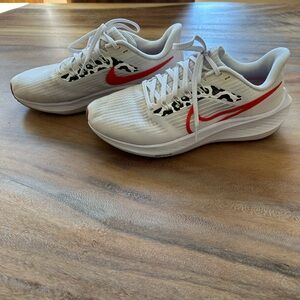 Women’s Nike White and Orange Pegasus 38 Air Zoom Running Shoes